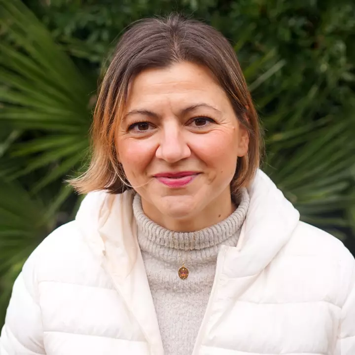 Portrait of Lusi, Administrative Assistant at Alma Forest School.